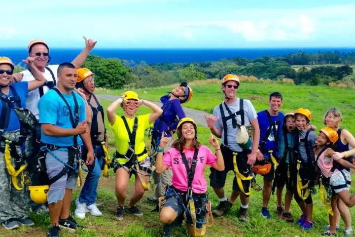 a group of people in a field posing for the camera