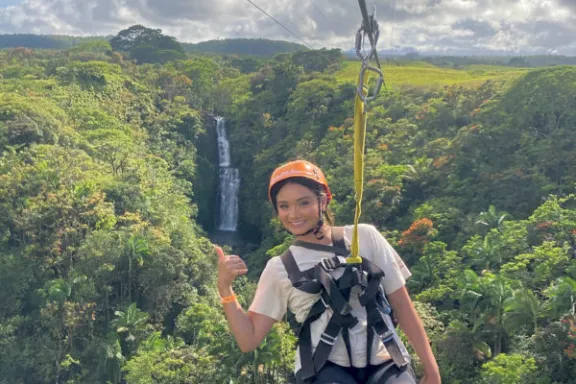 a person standing in front of a mountain