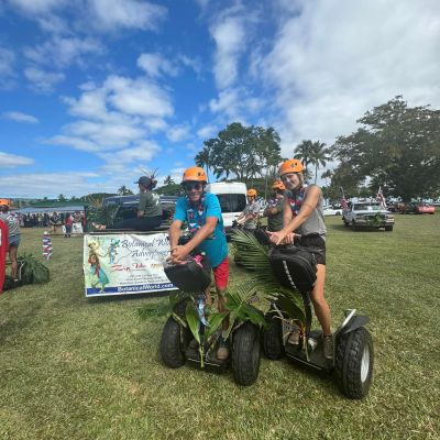 a group of people sitting in a field